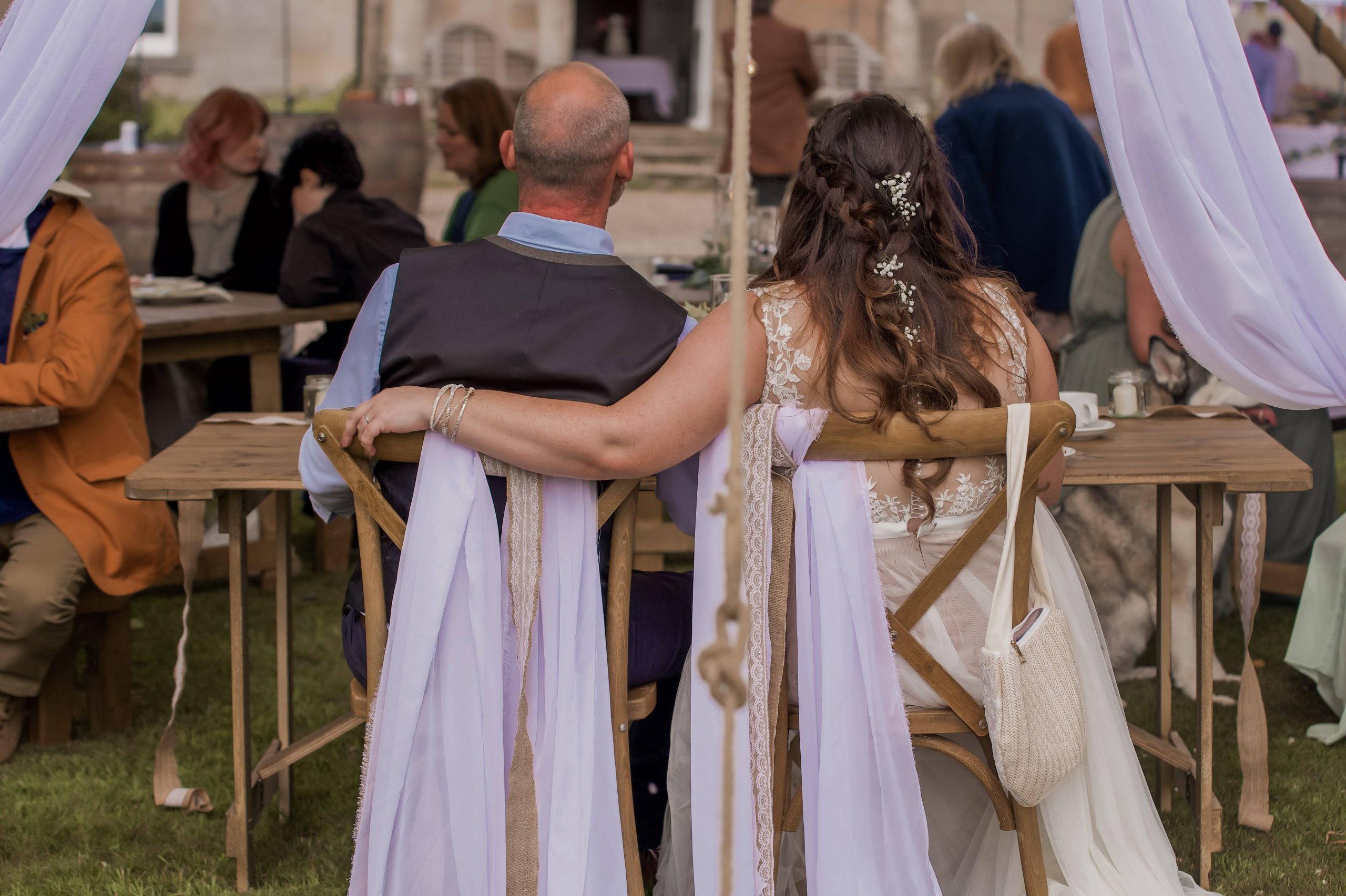 bride and groom under wedding awning, Bamburgh